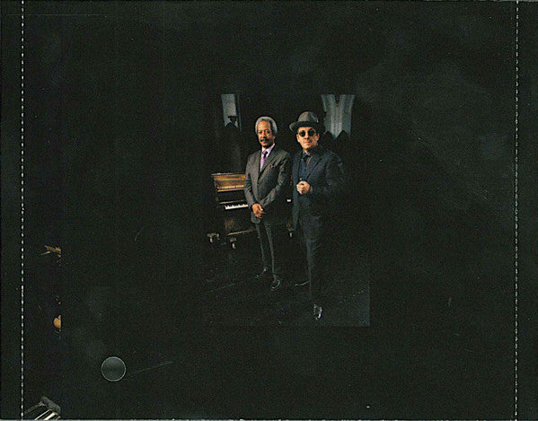 Elvis Costello - The River In Reverse (CD) | Near Mint- (NM-) Excellent (EX)-