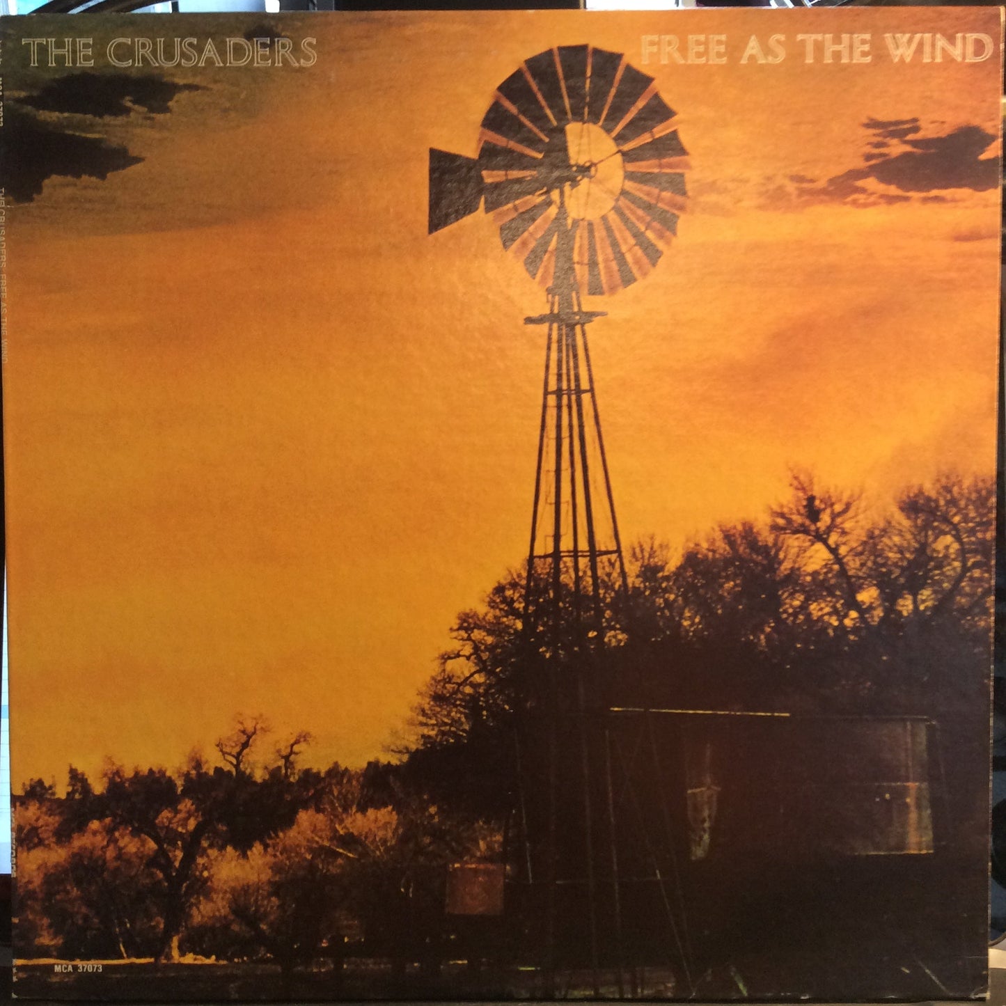 The Crusaders - Free As The Wind (VINYL) | Excellent+ (EX+) Excellent (EX)-