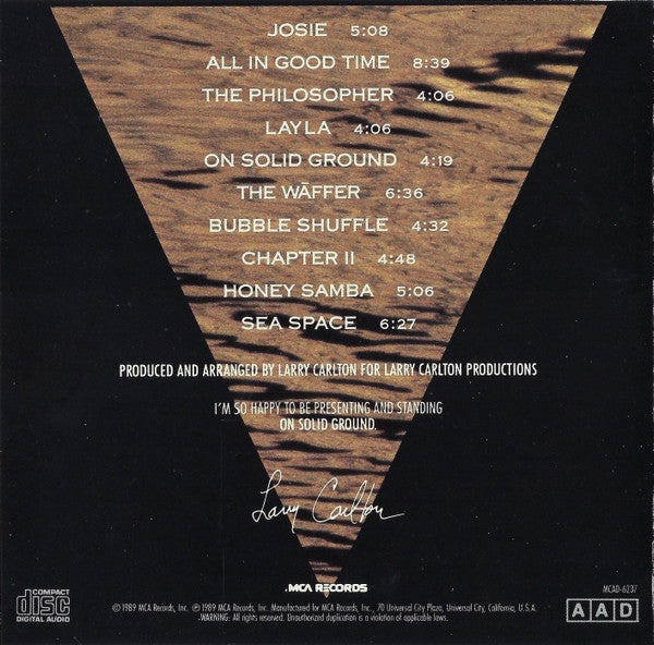 Larry Carlton - On Solid Ground (CD) | Near Mint (NM) Near Mint (NM)-