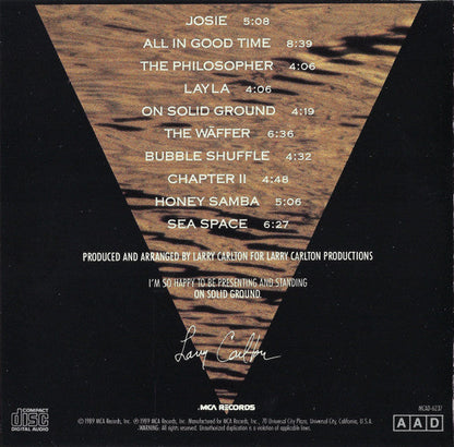 Larry Carlton - On Solid Ground (CD) | Near Mint (NM) Near Mint (NM)-