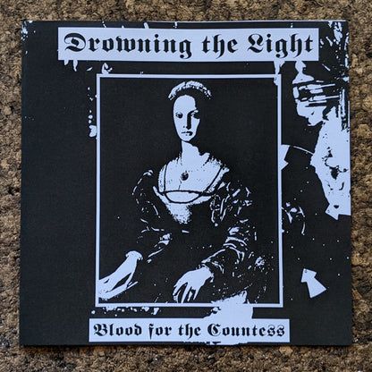 Drowning The Light - A Reflection Of The Past / Where The Sun Was Never Born (VINYL + 7") | Near Mint (NM or M-)-