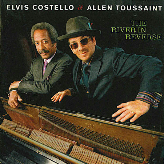 Elvis Costello - The River In Reverse (CD) | Near Mint- (NM-) Excellent (EX)-