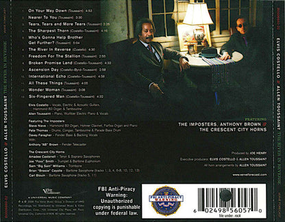 Elvis Costello - The River In Reverse (CD) | Near Mint- (NM-) Excellent (EX)-