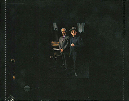 Elvis Costello - The River In Reverse (CD) | Near Mint- (NM-) Excellent (EX)-