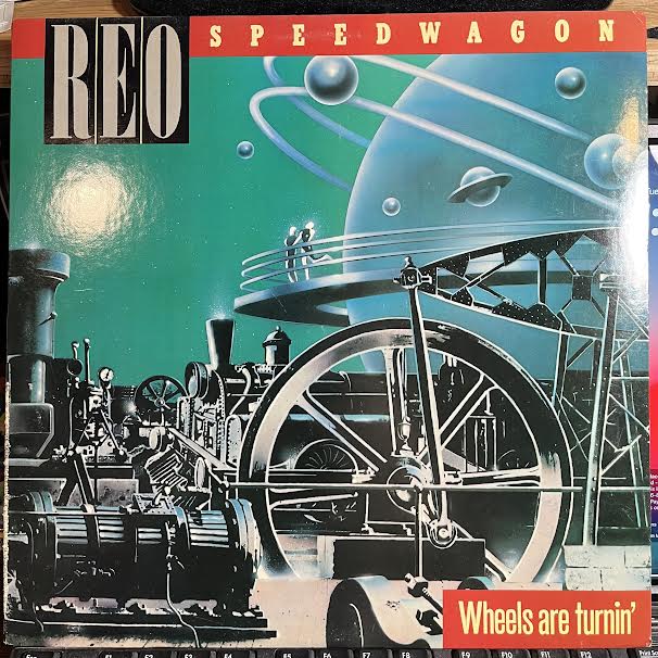 REO Speedwagon - Wheels Are Turnin' (VINYL) | Near Mint- (NM-) Excellent (EX)-