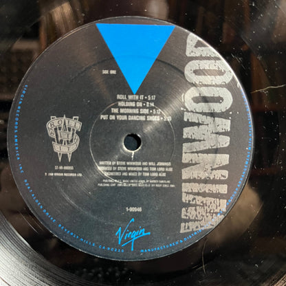 Steve Winwood - Roll With It (VINYL) | Near Mint- (NM-) Excellent+ (EX+)-