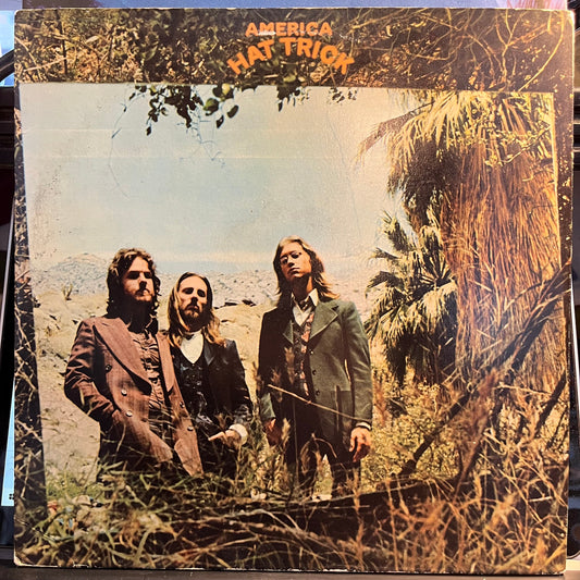 America (2) - Hat Trick (VINYL) | Near Mint (NM) Excellent (EX)-