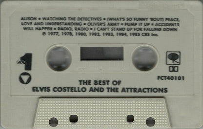 Elvis Costello & The Attractions - The Best Of Elvis Costello And The Attractions *CASSETTE* | Near Mint (NM) Near Mint (NM)-